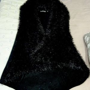 Beautiful cardigan vest.  Hangs below the hips comfortable light weight sweater.